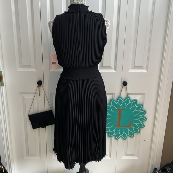 Fabulous LBD blouson dress featuring a smocked waist & accordion pleats - Picture 8 of 15